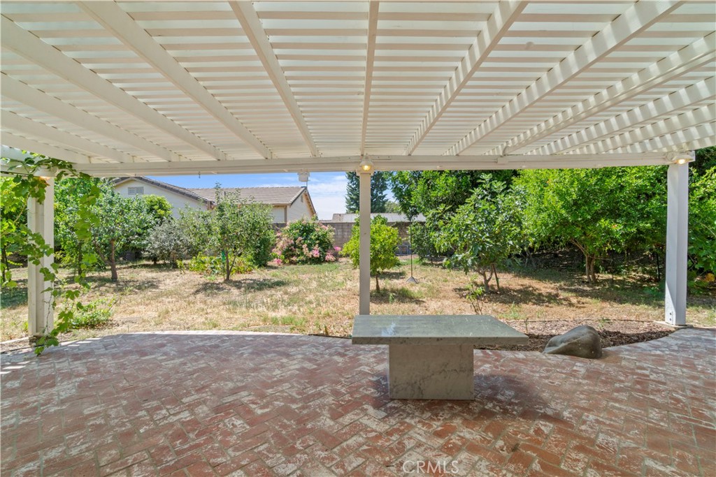 3367 Lathrop Avenue Simi Valley, CA 93063 - Photo 25 of 36 a view of a patio with a table and chairs under an umbrella