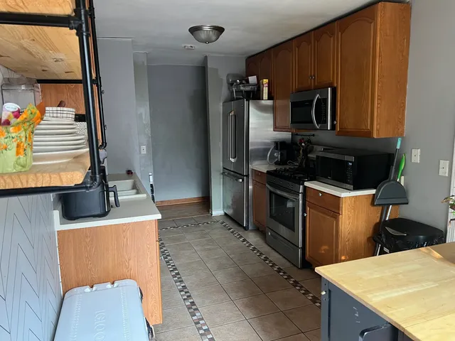 a kitchen with a sink appliances and cabinets