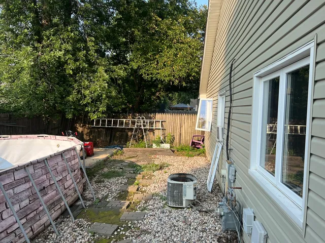 a view of a backyard with sitting area