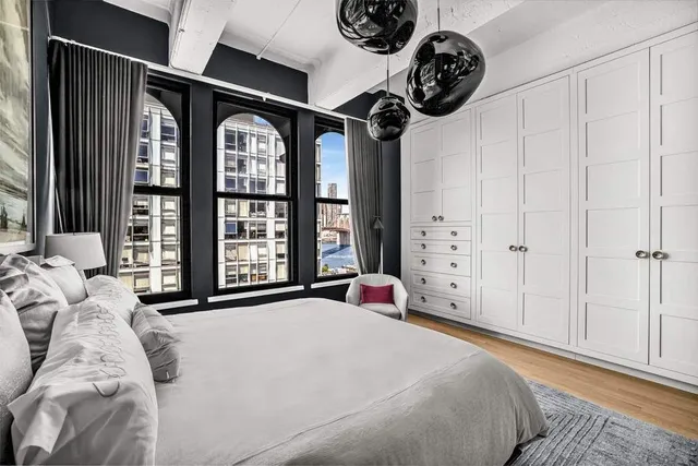 a bedroom with a large bed and a large window