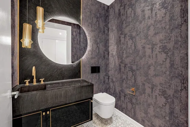 a bathroom with a toilet and a sink