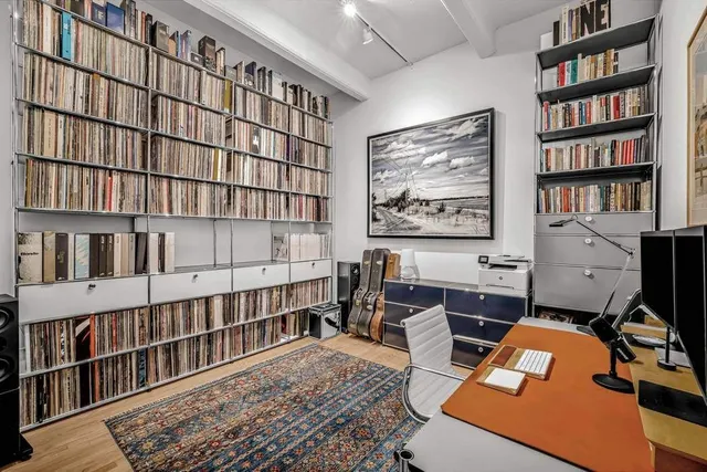 a reading room with furniture window and book shelf