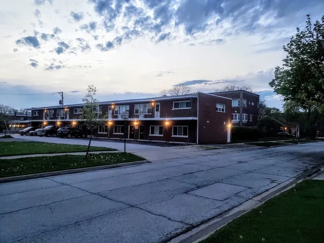 a view of street with houses in the background