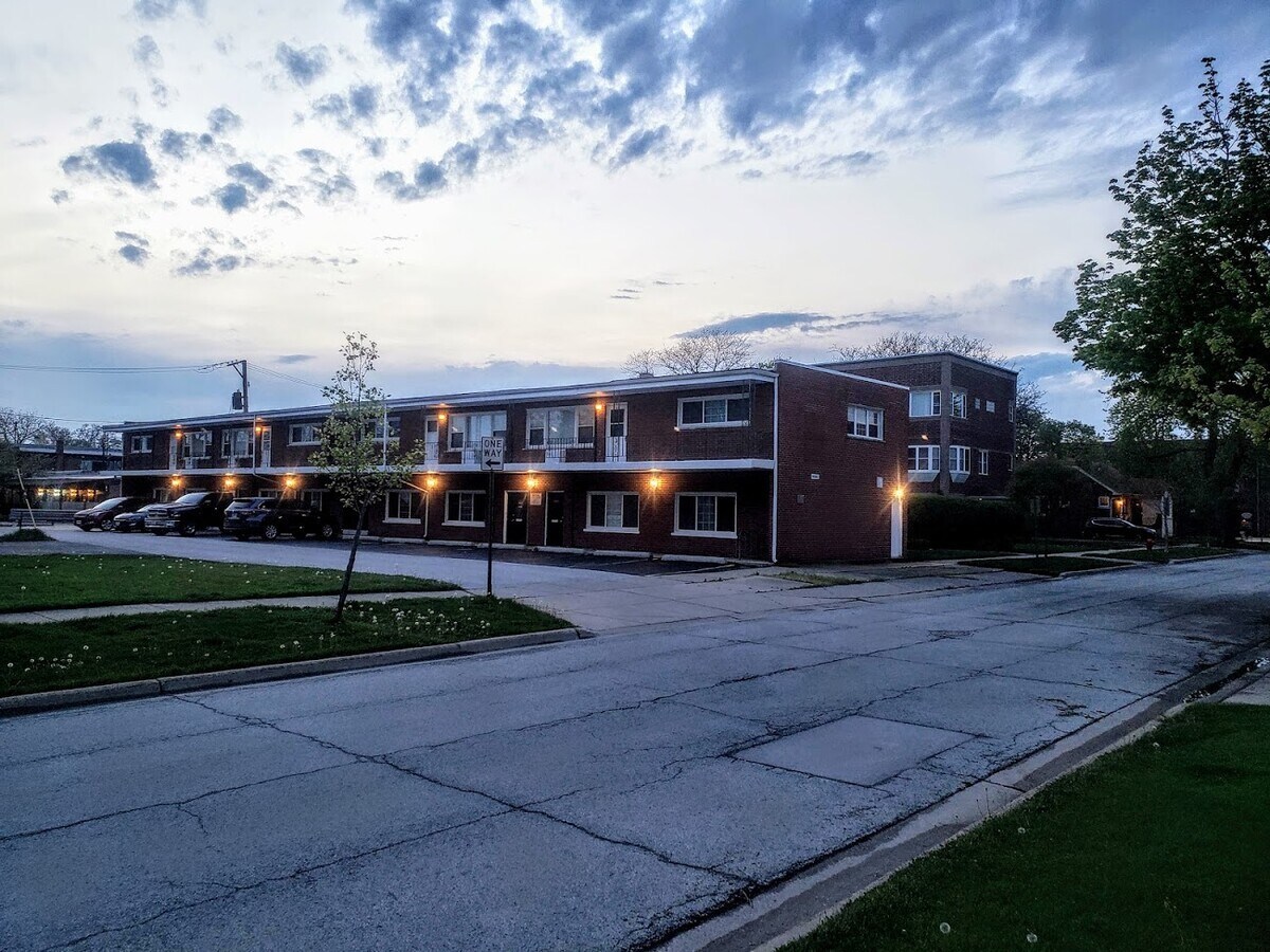 18154 Martin Avenue, Unit 4 Homewood, IL 60430 - Photo 1 of 5 a view of street with houses in the background
