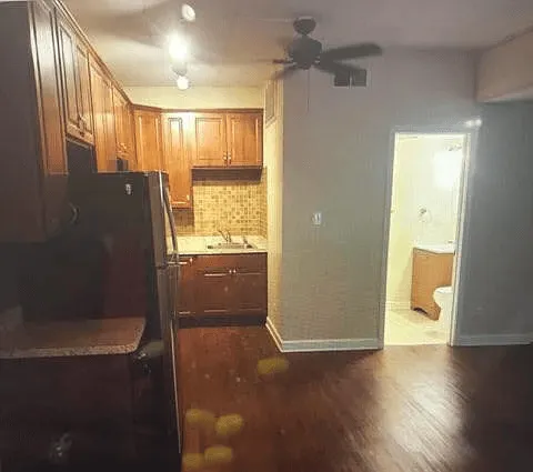 a bathroom with a glass shower door