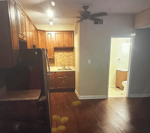 18154 Martin Avenue, Unit 4 Homewood, IL 60430 - Photo 2 of 5 a bathroom with a glass shower door