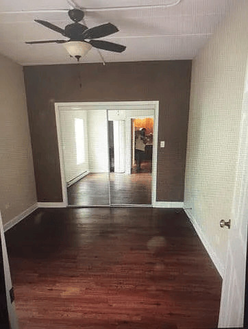 18154 Martin Avenue, Unit 4 Homewood, IL 60430 - Photo 3 of 5 wooden floor in an empty room with a window