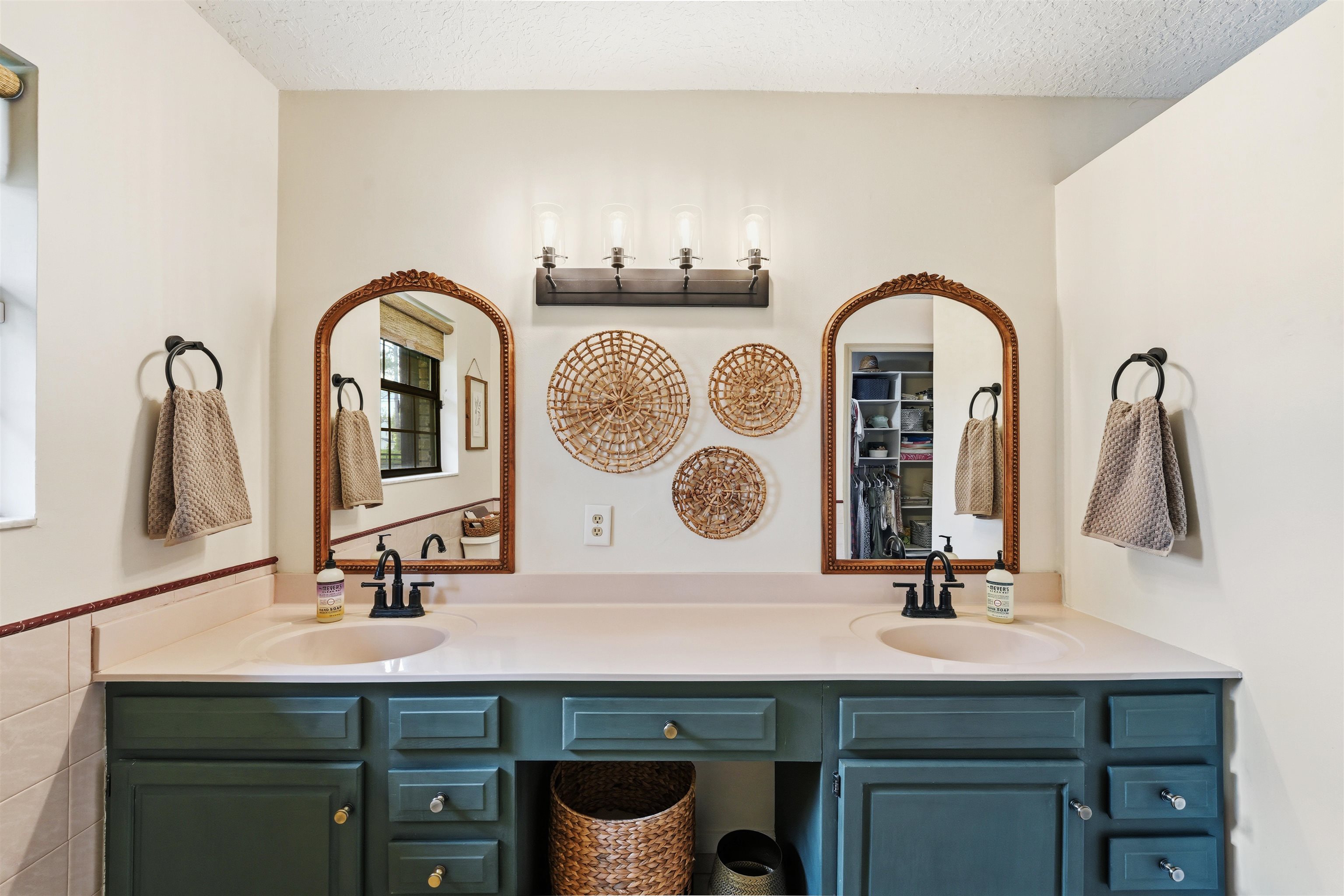 1805 Bennett Road St. Augustine, FL 32092 - Photo 23 of 65 a bathroom with a sink and a mirror