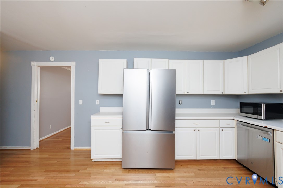 11515 Patillo Road Dewitt, VA 23840 - Photo 11 of 35 a kitchen with a refrigerator sink and cabinets