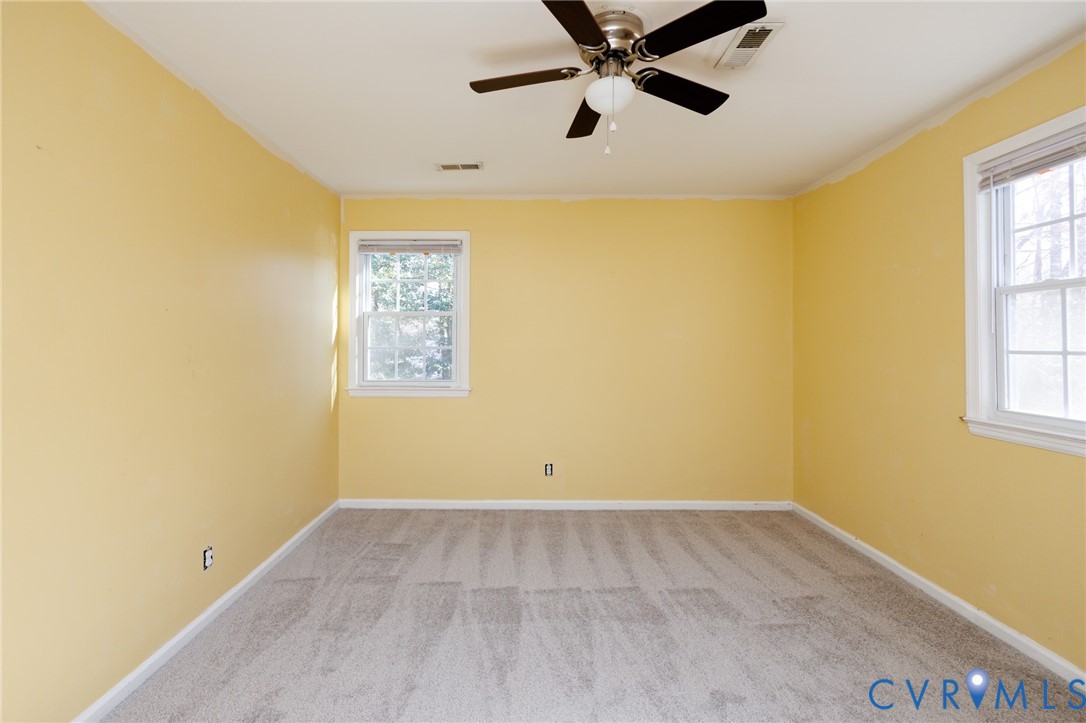 11515 Patillo Road Dewitt, VA 23840 - Photo 13 of 35 a view of an empty room with wooden floor and a window