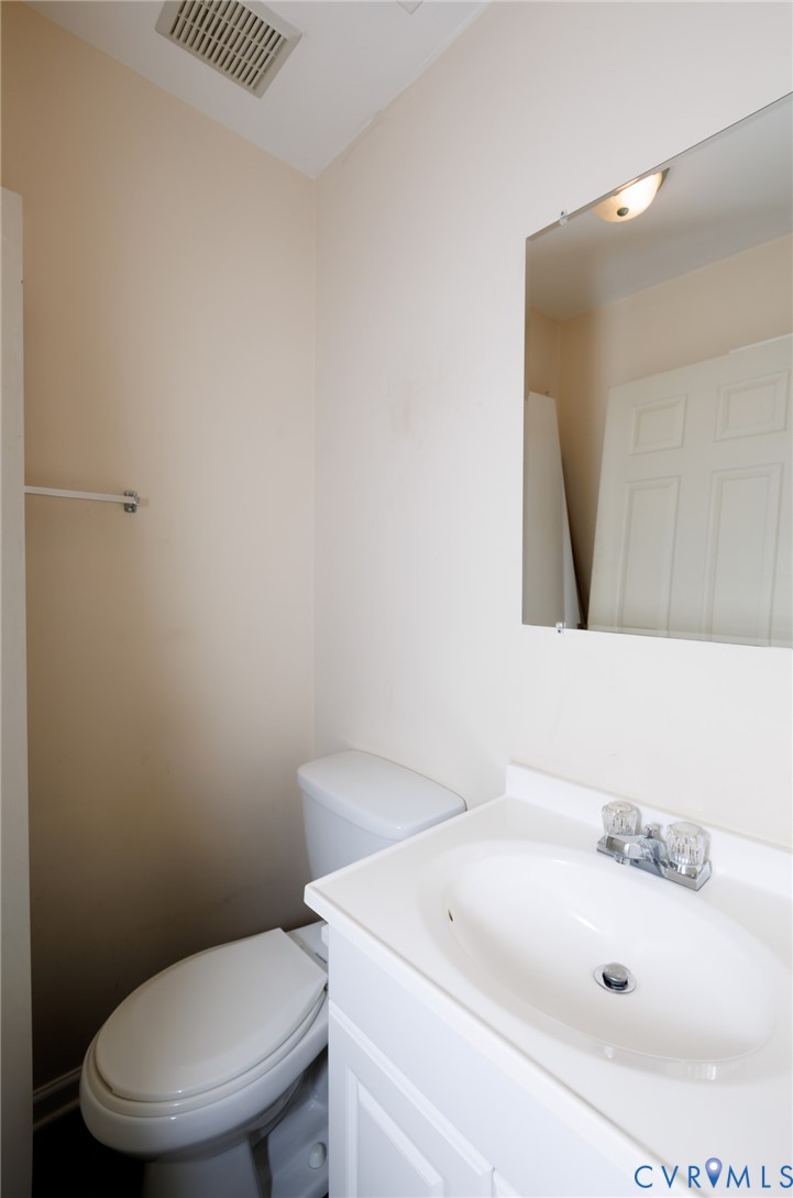 11515 Patillo Road Dewitt, VA 23840 - Photo 15 of 35 a bathroom with a sink a toilet and mirror