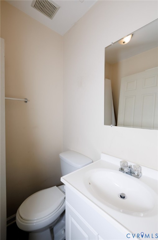 11515 Patillo Road Dewitt, VA 23840 - Photo 15 of 35 a bathroom with a sink a toilet and mirror