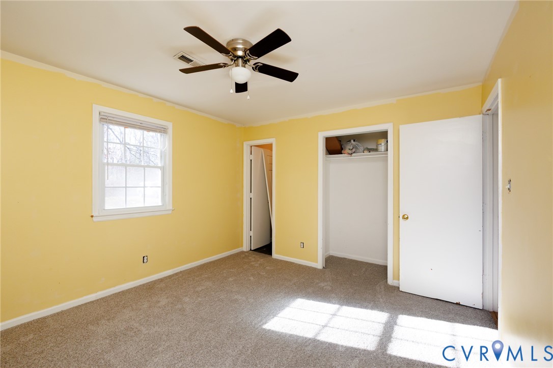 11515 Patillo Road Dewitt, VA 23840 - Photo 17 of 35 a view of a big room with wooden floor and windows
