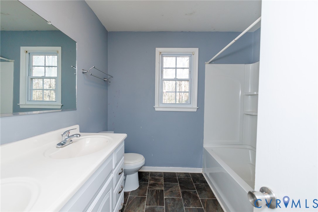 11515 Patillo Road Dewitt, VA 23840 - Photo 18 of 35 a bathroom with a sink toilet and shower