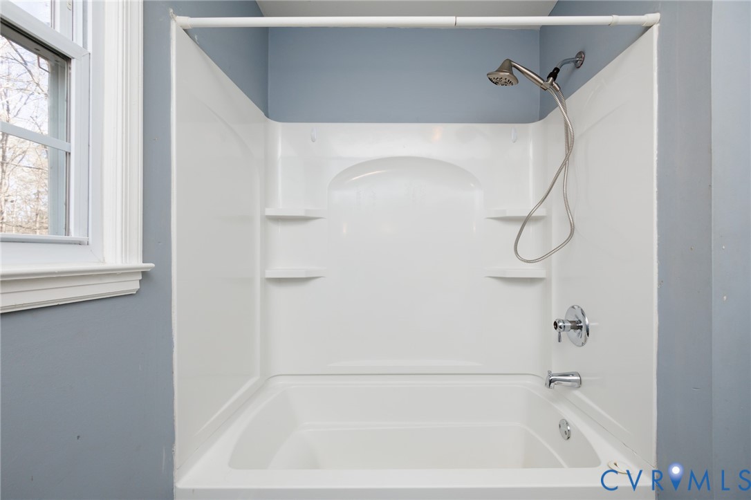 11515 Patillo Road Dewitt, VA 23840 - Photo 19 of 35 a bathroom with a bath tub with a shower