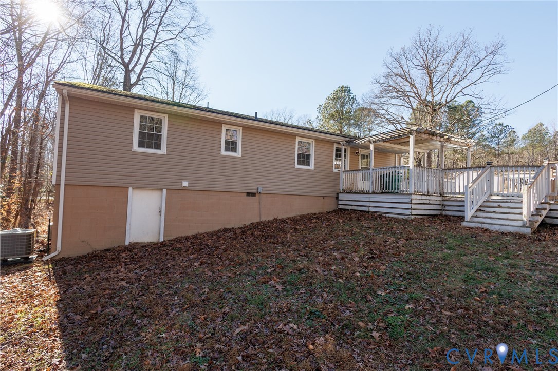 11515 Patillo Road Dewitt, VA 23840 - Photo 34 of 35 a backyard of a house with barbeque oven and wooden fence