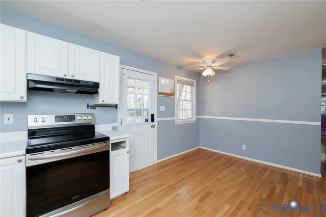 a kitchen with a stove and a microwave