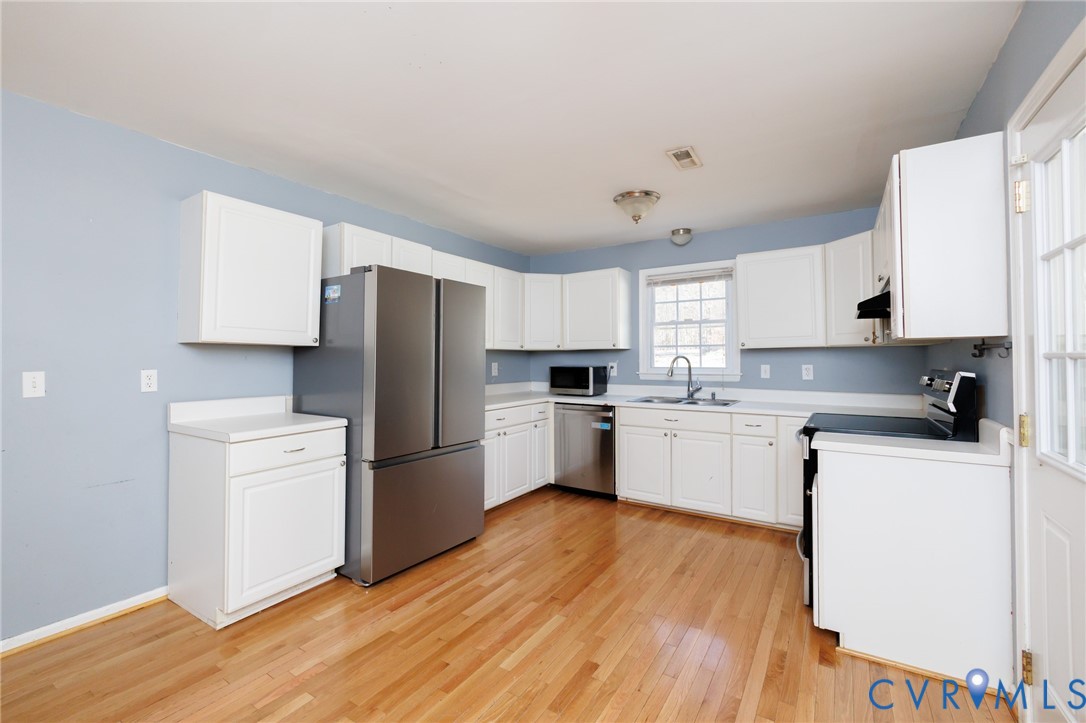 11515 Patillo Road Dewitt, VA 23840 - Photo 10 of 35 a kitchen with a refrigerator stove top oven and sink
