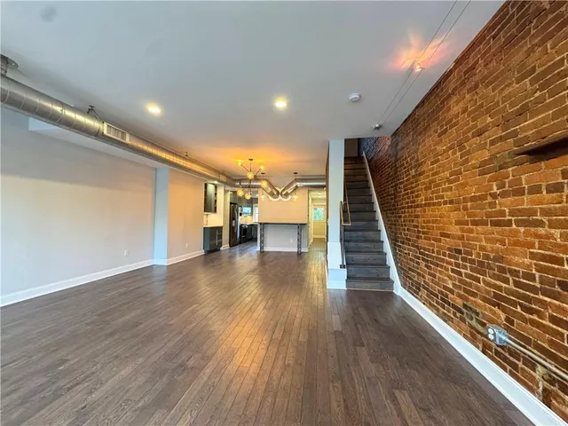 a view of entryway with wooden floor