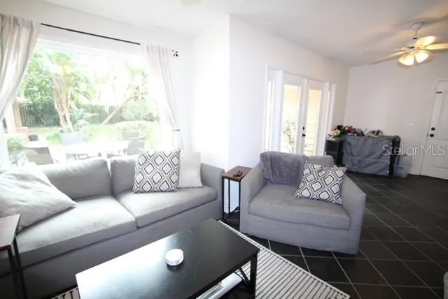 a living room with furniture and a large window