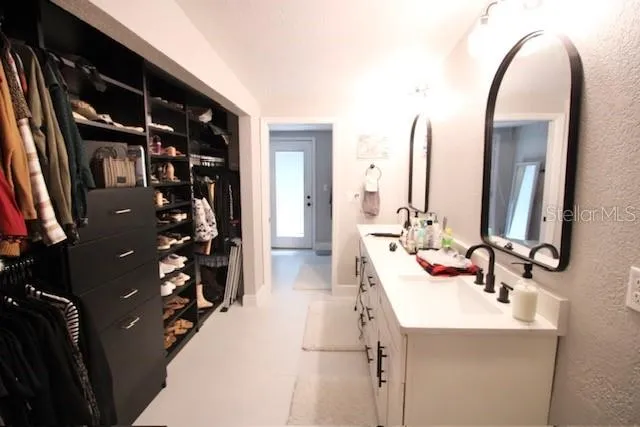 a bathroom with a double vanity sink
