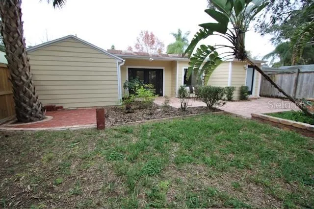 a house view with a sitting space and garden