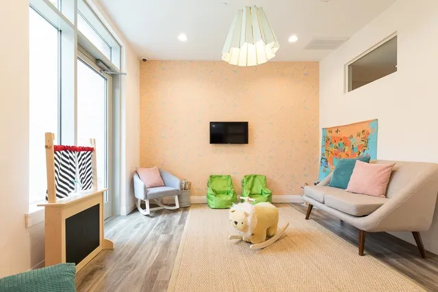 a view of a patio with couches table and chairs and potted plants