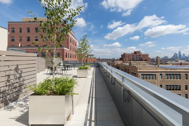 a view of a chairs and table in patio