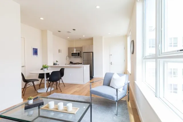 a kitchen with a dining table and chairs