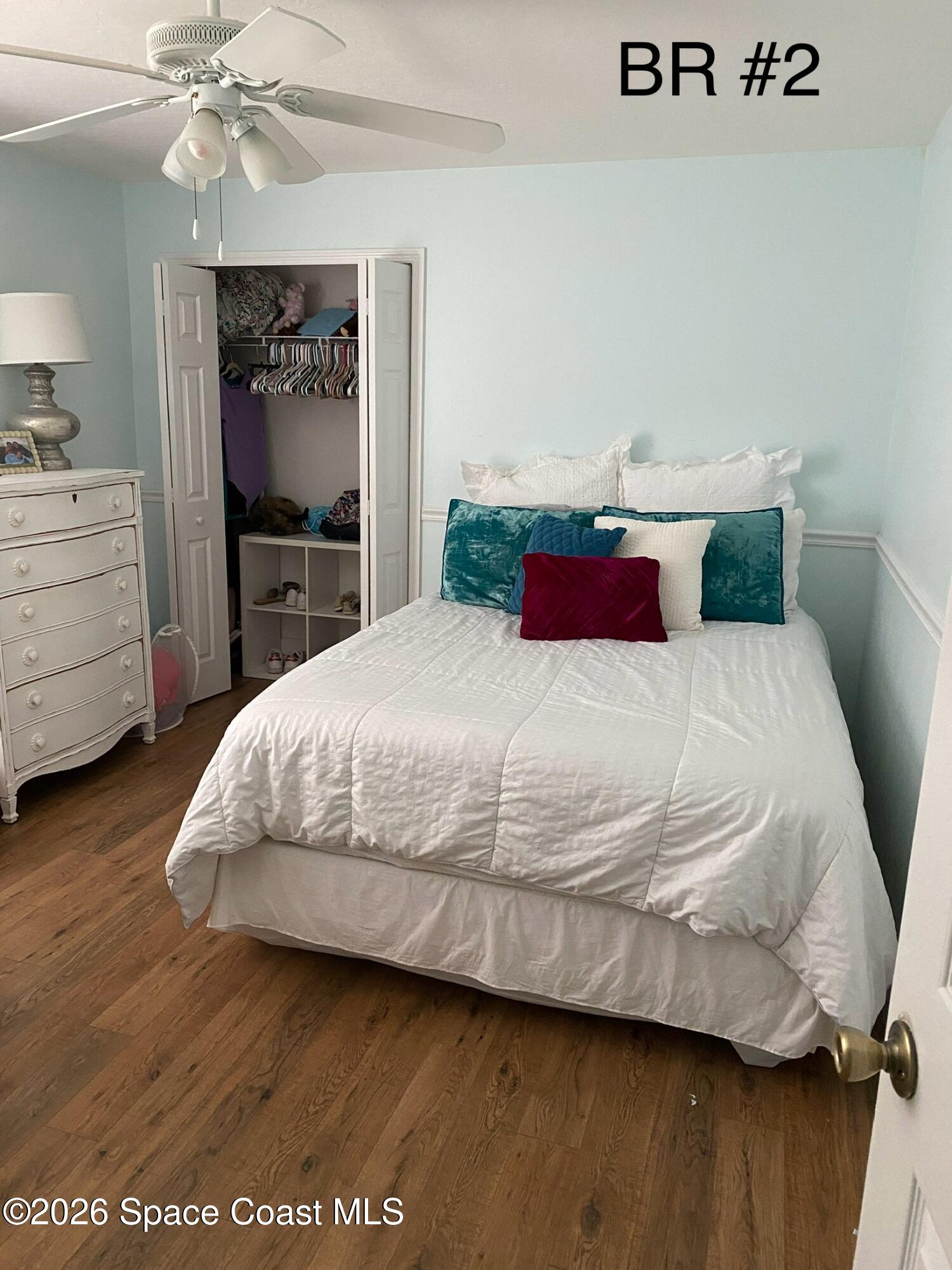 4130 Orion Way Rockledge, FL 32955 - Photo 2 of 14 a bedroom with a bed and a flat tv screen on dresser