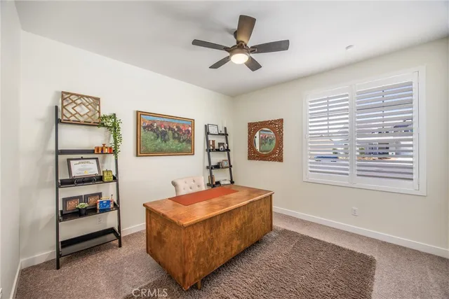 a living room with furniture and window