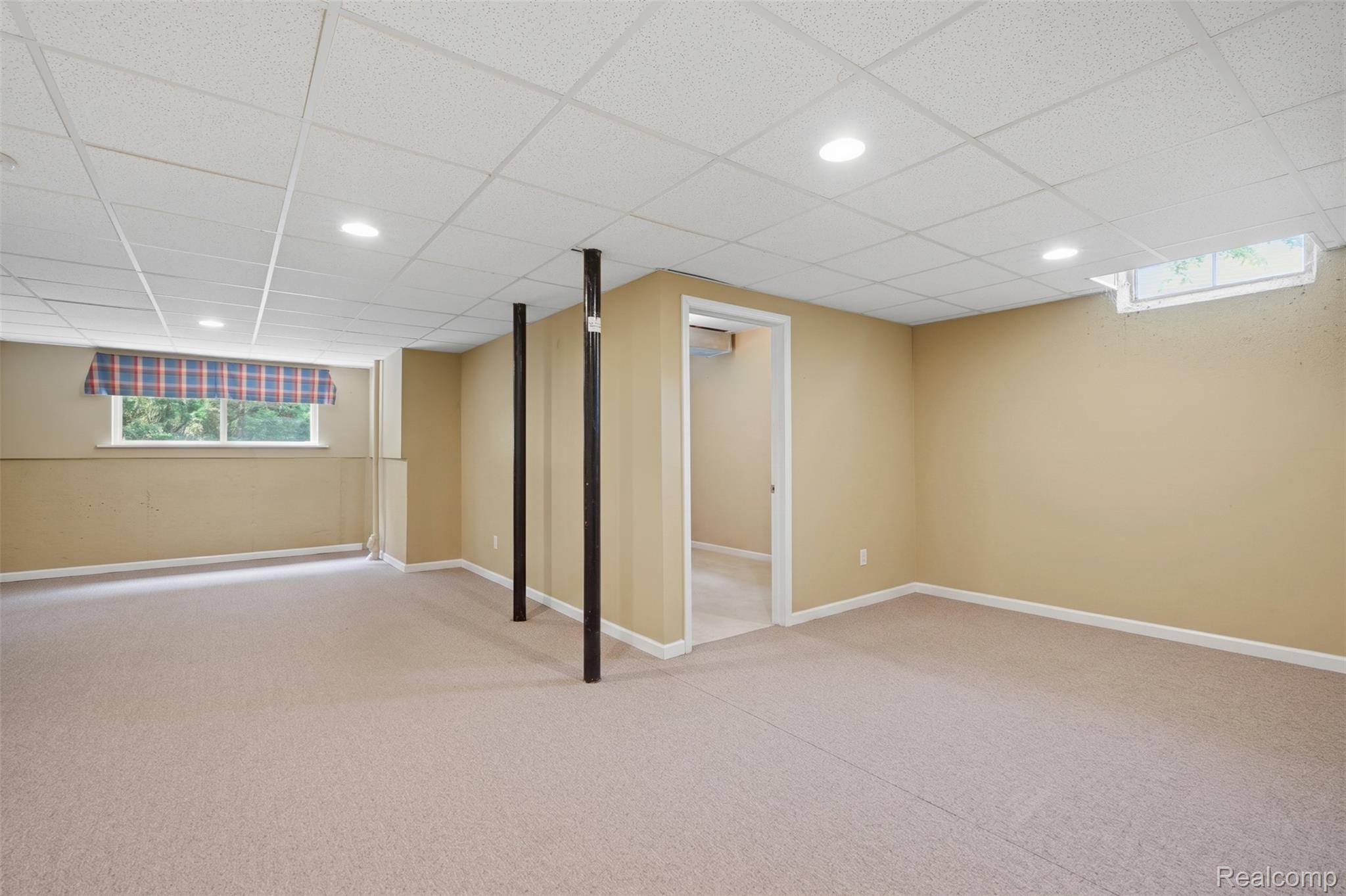 170 Fairhill Way Howell, MI 48843 - Photo 34 of 46 Finished lower level featuring recessed lighting, a drop ceiling, and neutral carpeting