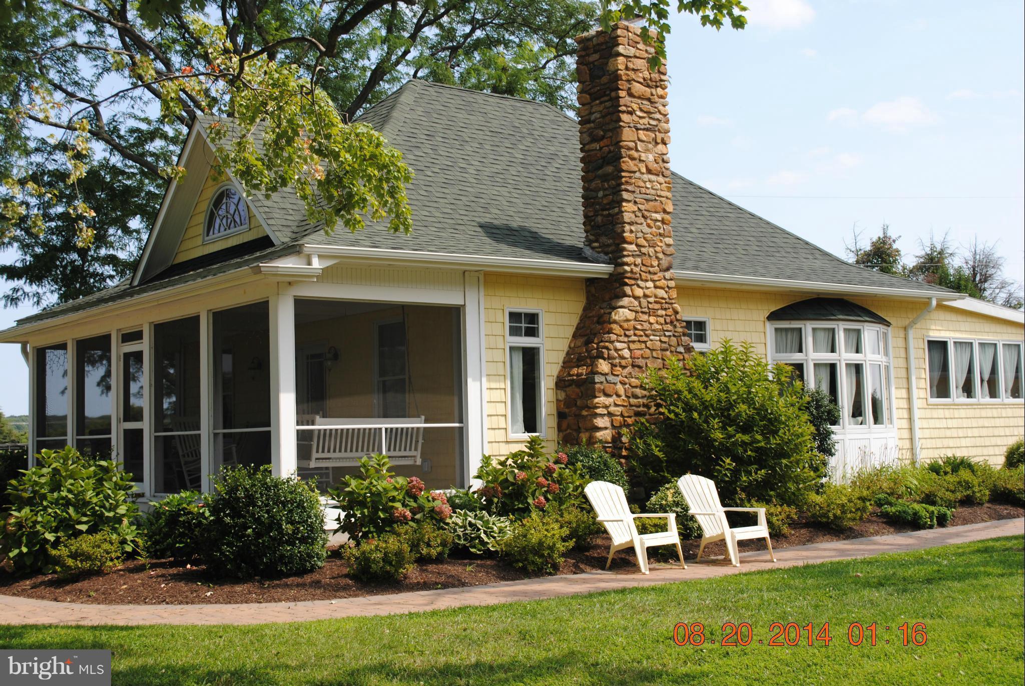 Main House has screened porch overlooking Swan Ck