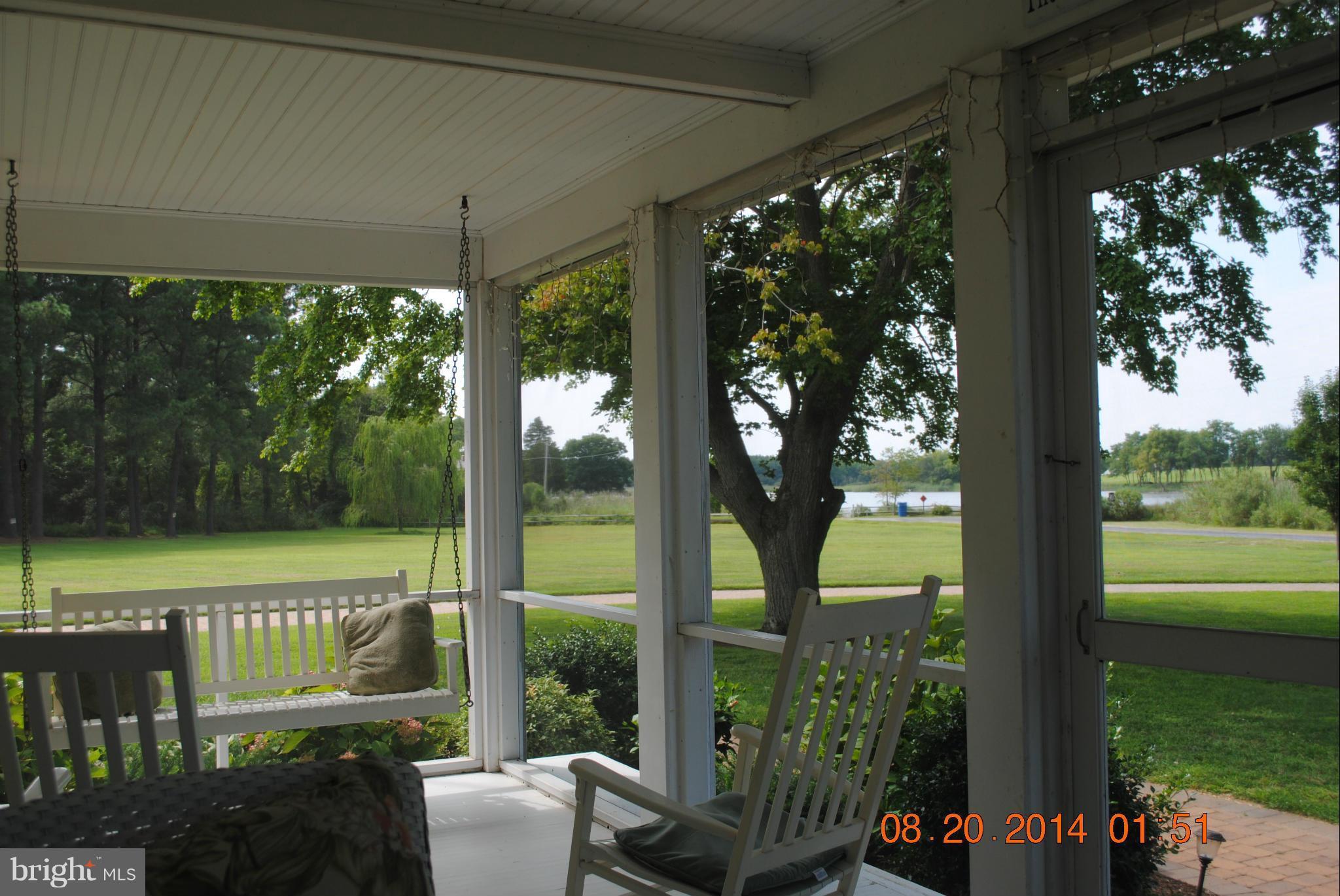 Screened porch on front of main house