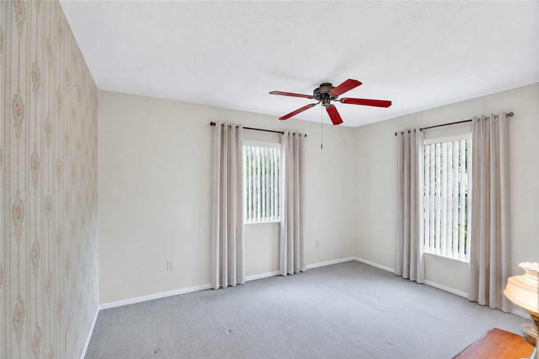 7666 134th Street Sebastian, FL 32958 - Photo 10 of 35 an empty room with ceiling fan and window