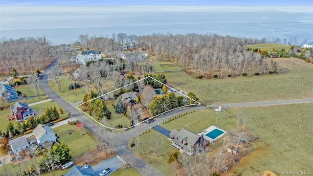 an aerial view of a residential houses with outdoor space