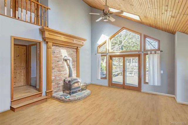 a view of an entryway with wooden floor and door