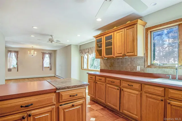 a view of a kitchen counter space and windows