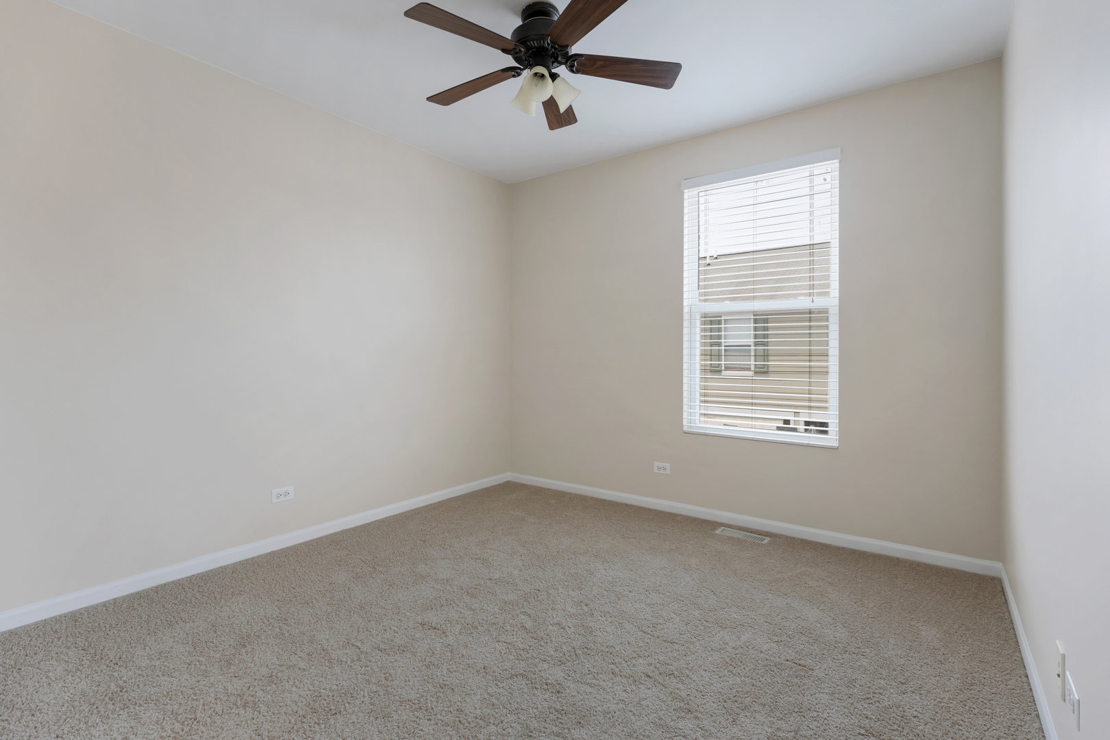 2441 Emily Lane Elgin, IL 60124 - Photo 20 of 27 an empty room with a window and a fan