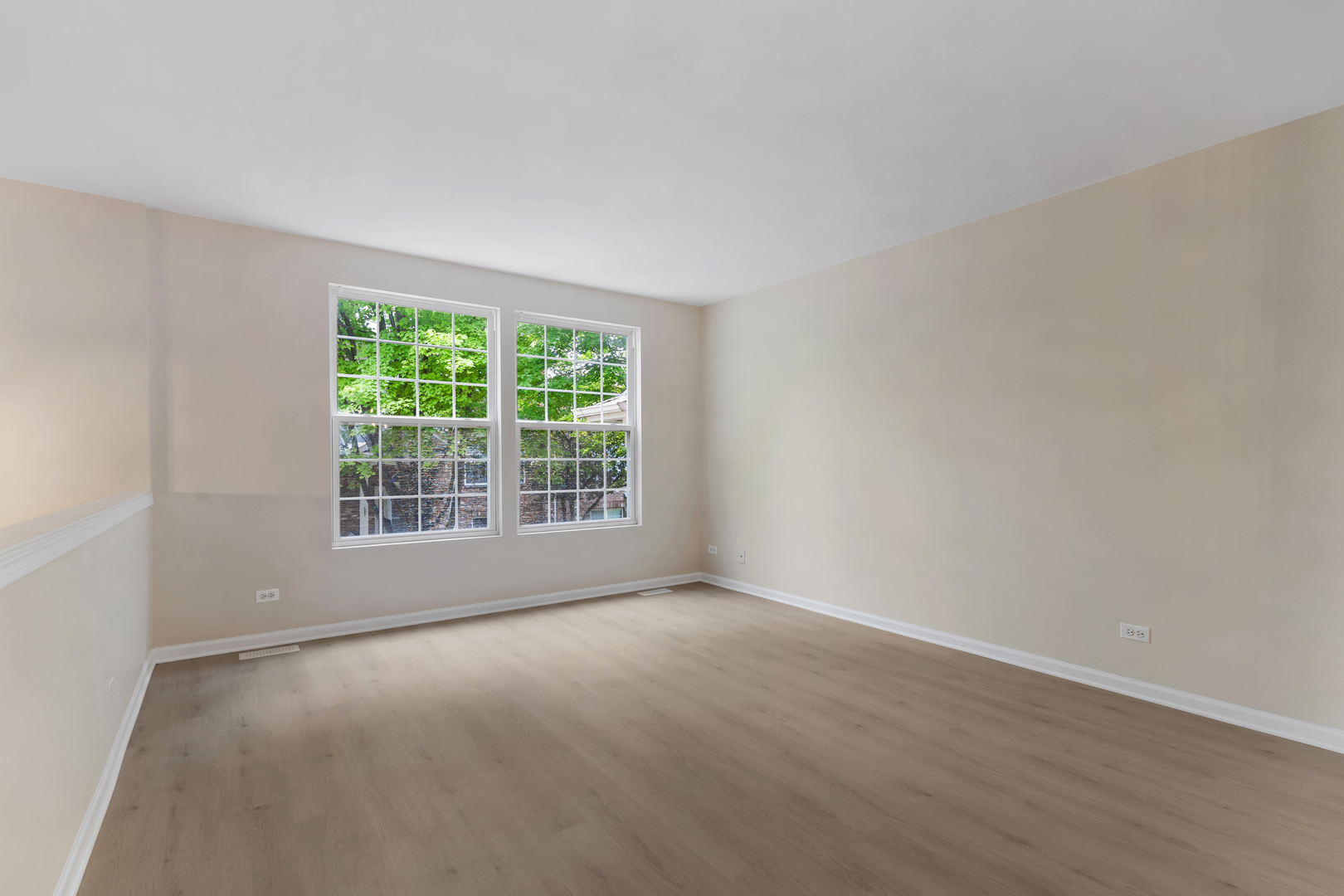 2441 Emily Lane Elgin, IL 60124 - Photo 5 of 27 a view of an empty room with wooden floor and a window