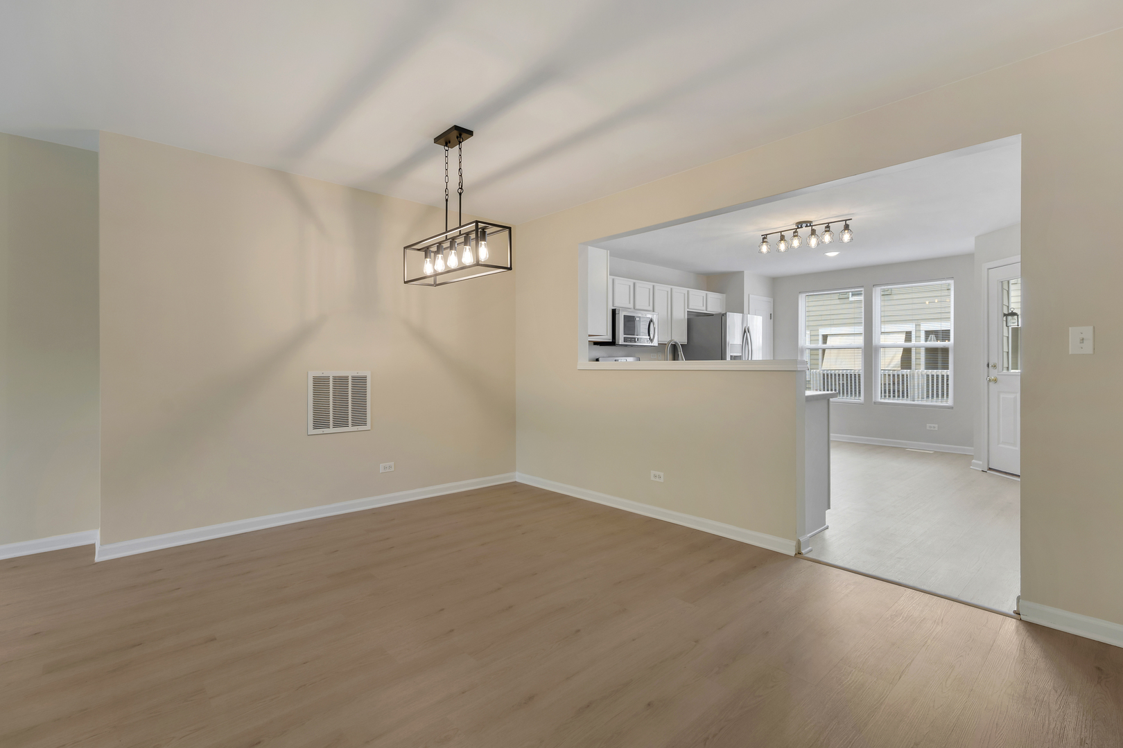 2441 Emily Lane Elgin, IL 60124 - Photo 8 of 27 an empty room with windows and entrance