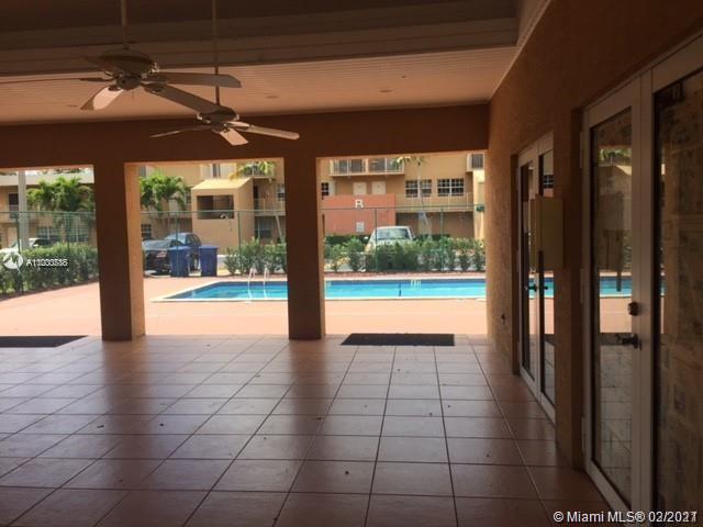 7510 Southwest 152nd Avenue, Unit A208 Miami, FL 33193 - Photo 3 of 9 a view of an entryway with a floor to ceiling window