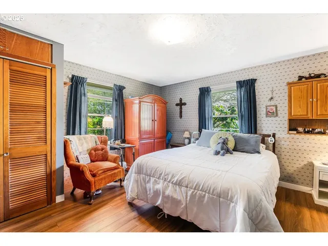 a bedroom with a bed and a couch