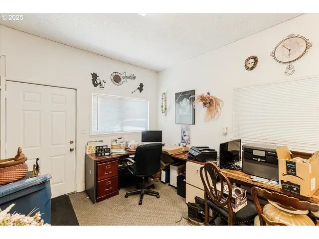 a view of a workspace with furniture