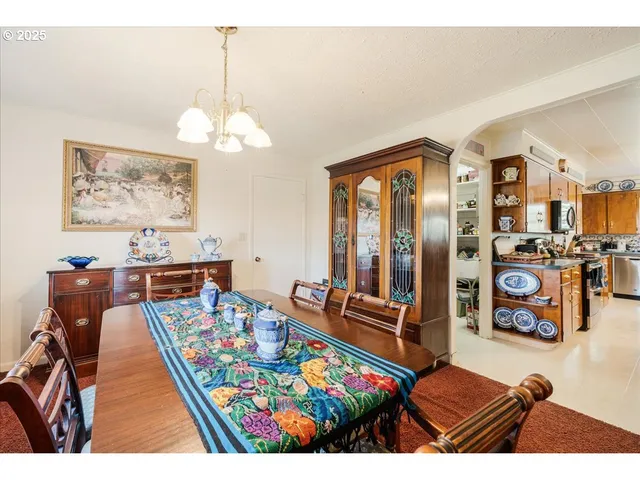 a bedroom with furniture and a chandelier