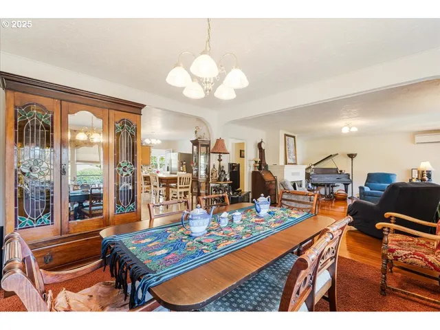 a living room with lots of furniture and a large window