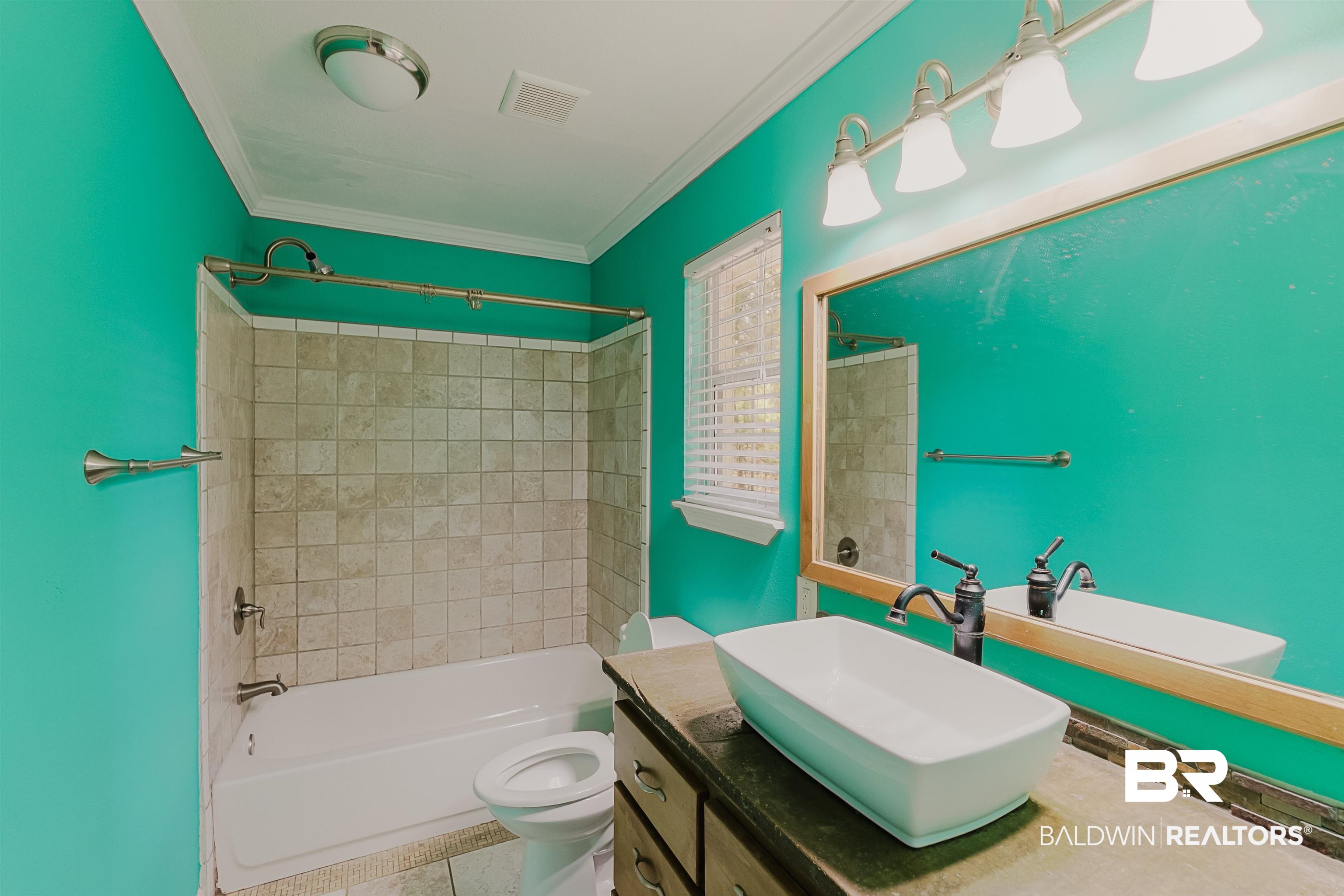 14185 Jackson Lane Foley, AL 36535 - Photo 7 of 16 Bathroom featuring shower combination, vanity, ornamental molding, and tile patterned flooring