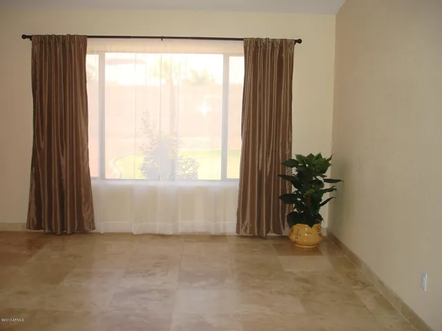 a bathroom with a shower and a glass door