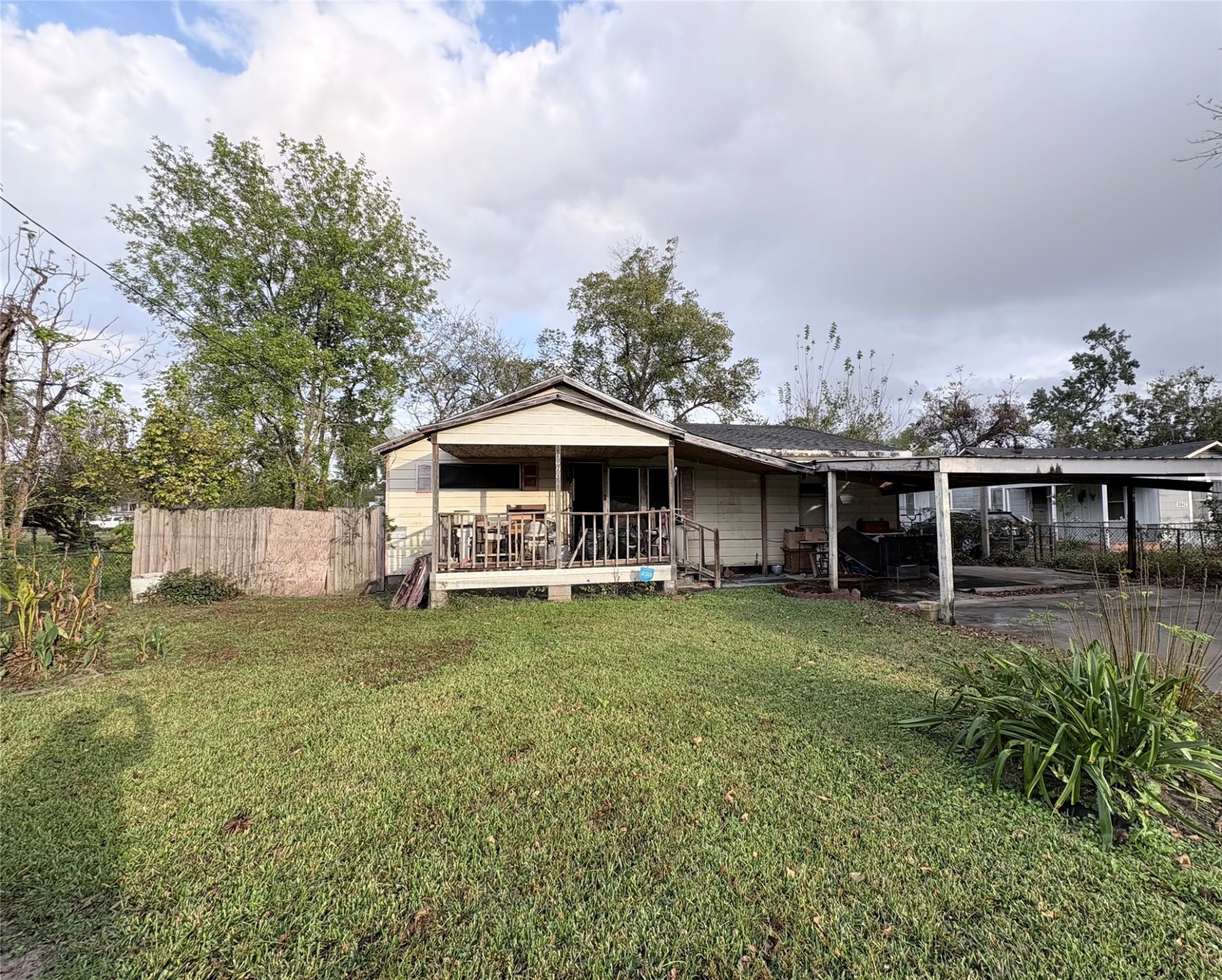 8922 Heatherside Street Houston, TX 77016 - Photo 2 of 6 a view of a house with a yard and sitting area