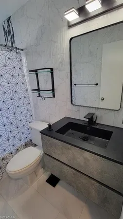 a bathroom with a bathtub and window